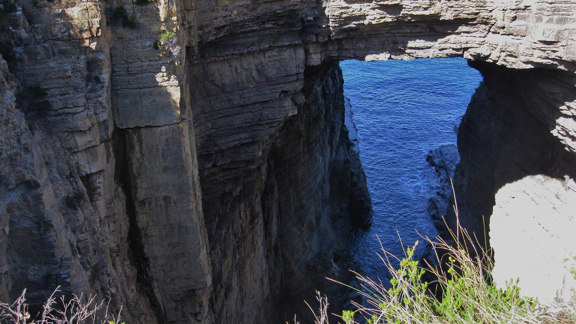 Tasman Arch, a sea-carved sandstone bridge in Tasman National Park